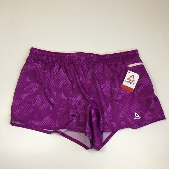 NWT REEBOK Relaxed All Around Inner Short Passionate Plum Zip Pocket Shorts - Picture 1 of 11
